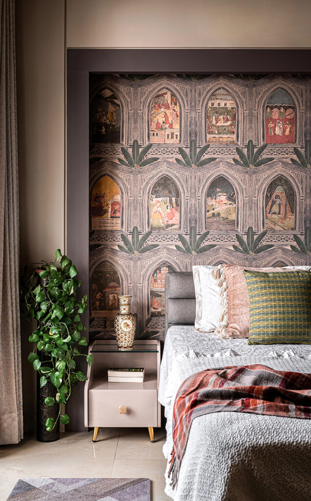 Wall mural featuring intricate designs and scenes in a bedroom setting with a bed and plant.